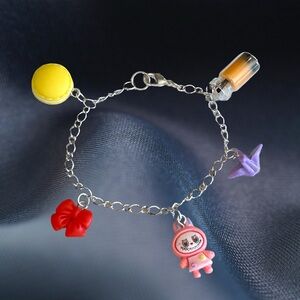 Silver Plated Charm Bracelet with Colorful Charms; 7 inches.